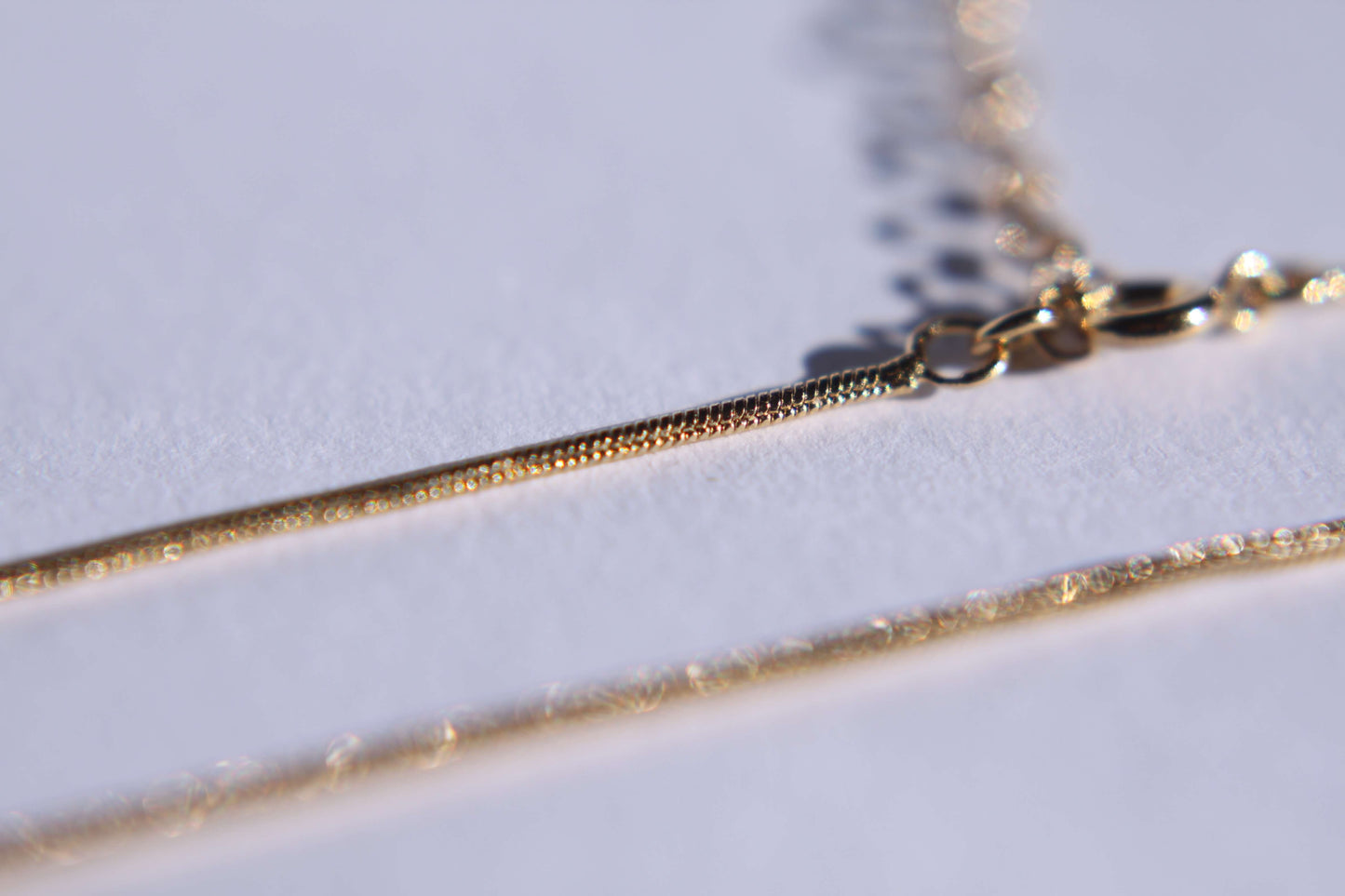 Chaine maille serpent plaqué or