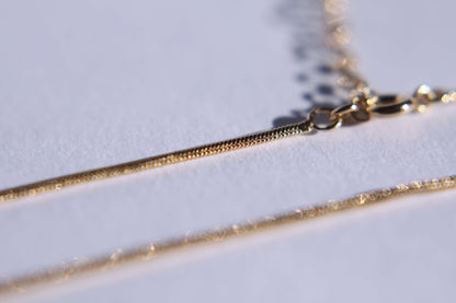 Chaine maille serpent plaqué or