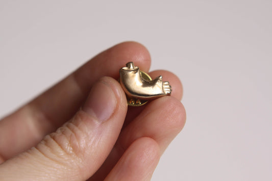 Pins Bras cassé