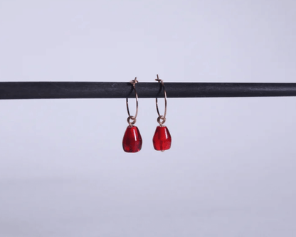 boucles d'oreilles représentant des graines de grenade