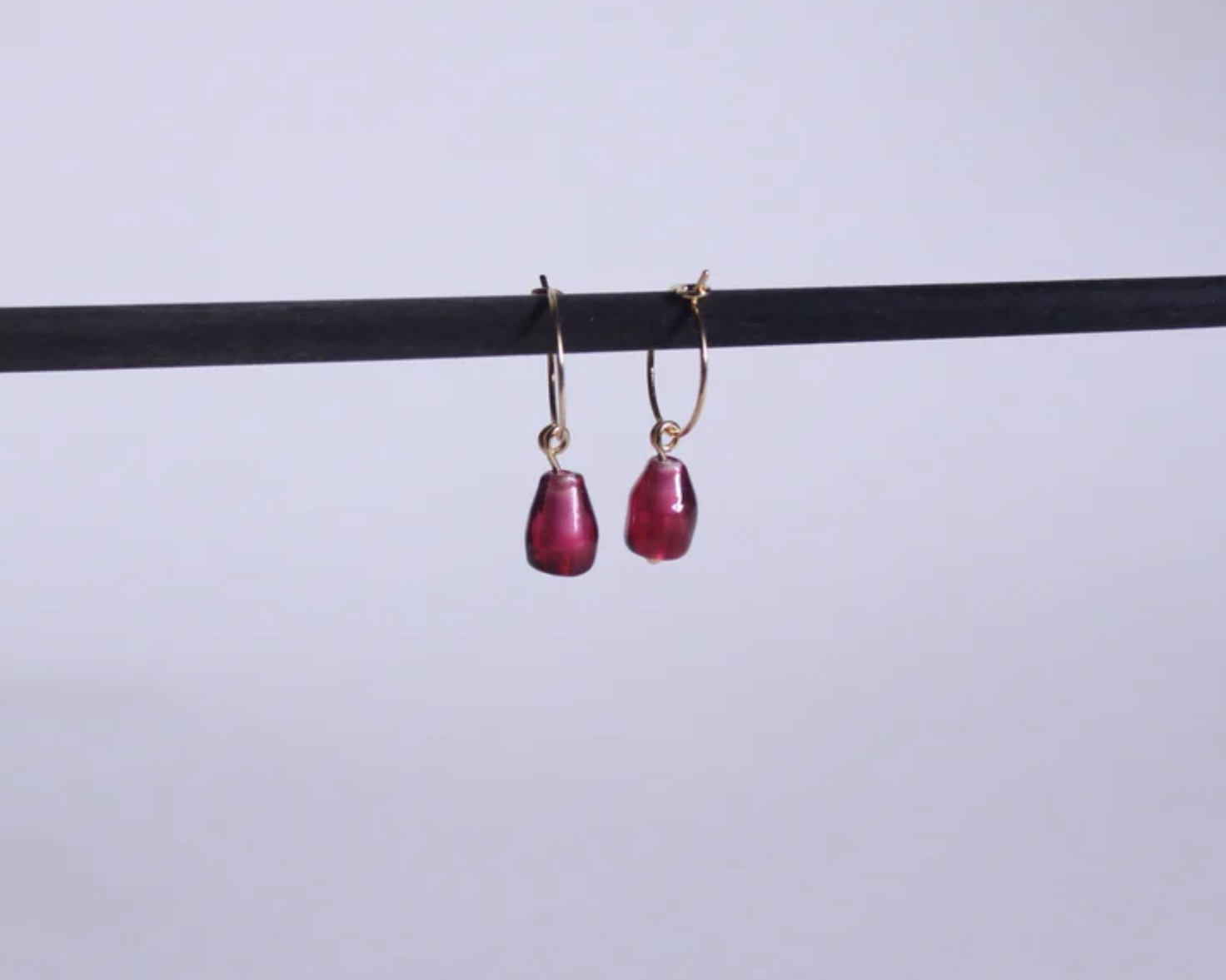 boucles d'oreilles en laiton symbolisant des graines de grenades