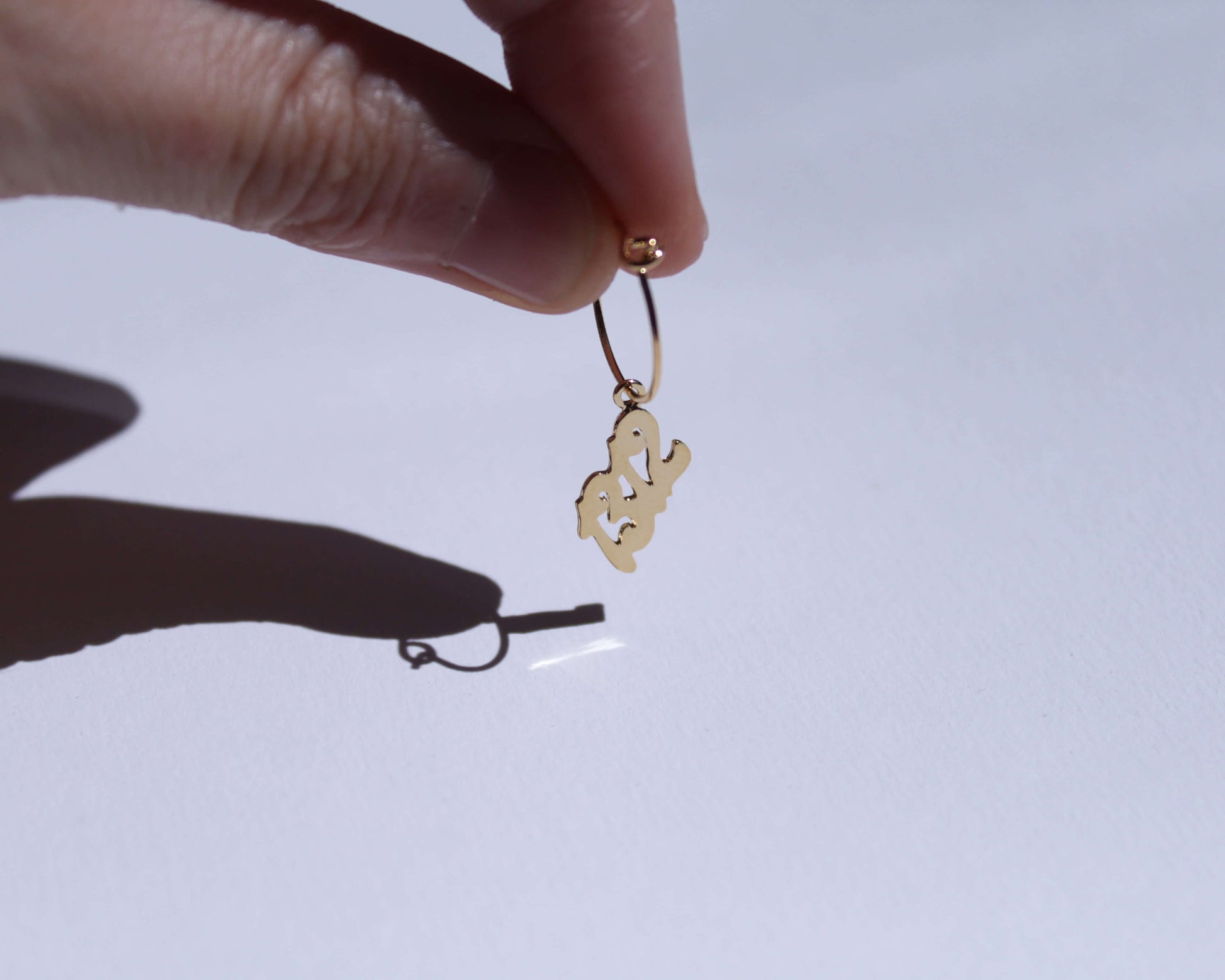 boucles d'oreilles en laiton doré représentant le nombre "1312"