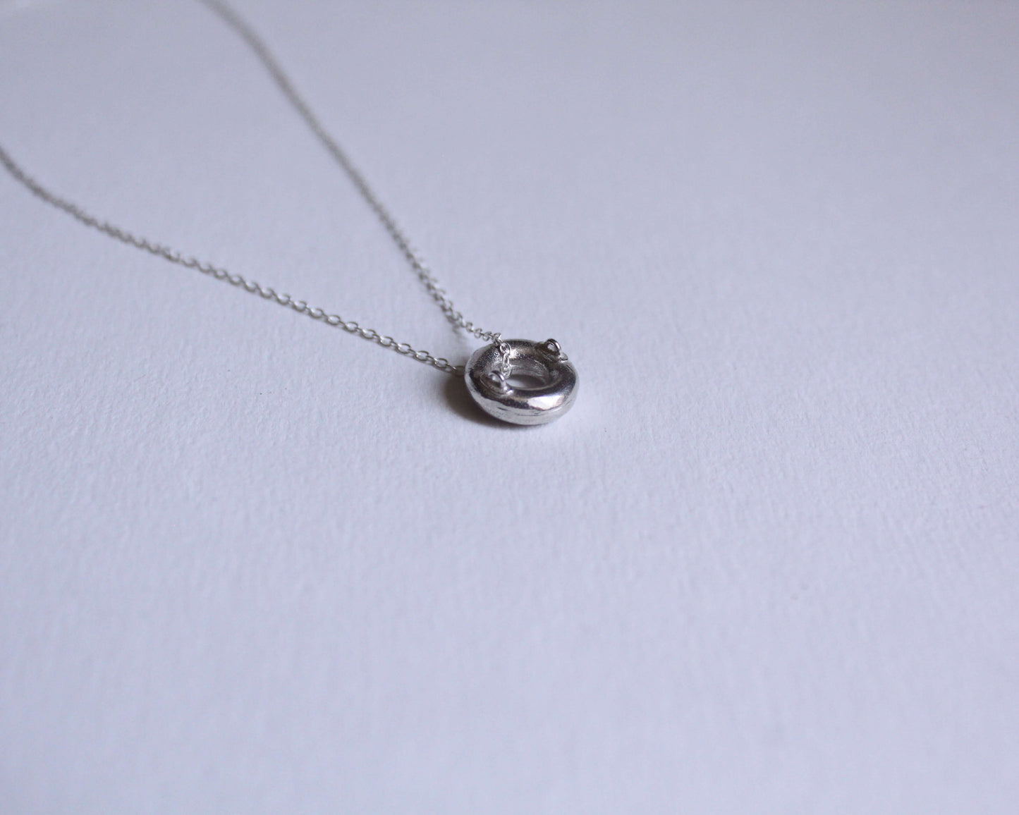 pendentif en argent massif en forme de bouée