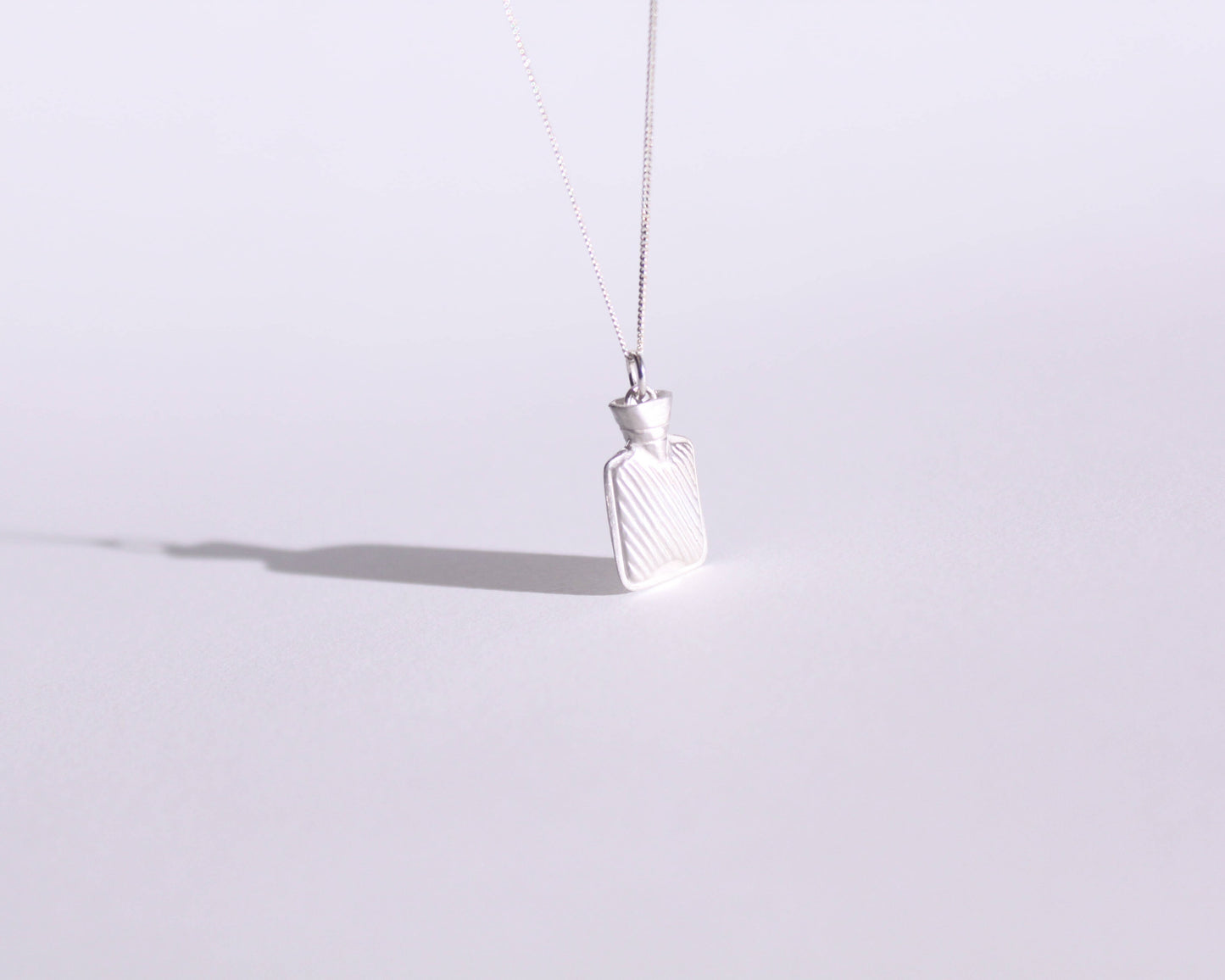 pendentif en argent massif en forme de bouillotte