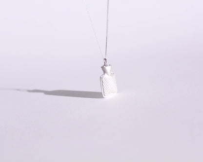 pendentif en argent massif en forme de bouillotte