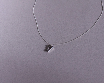 pendentif en argent massif représentant un escalier de Penrose